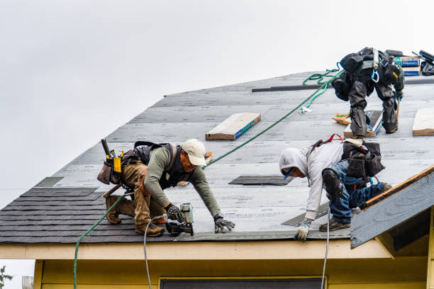 Professional Roofing technician working in Kensington, CA